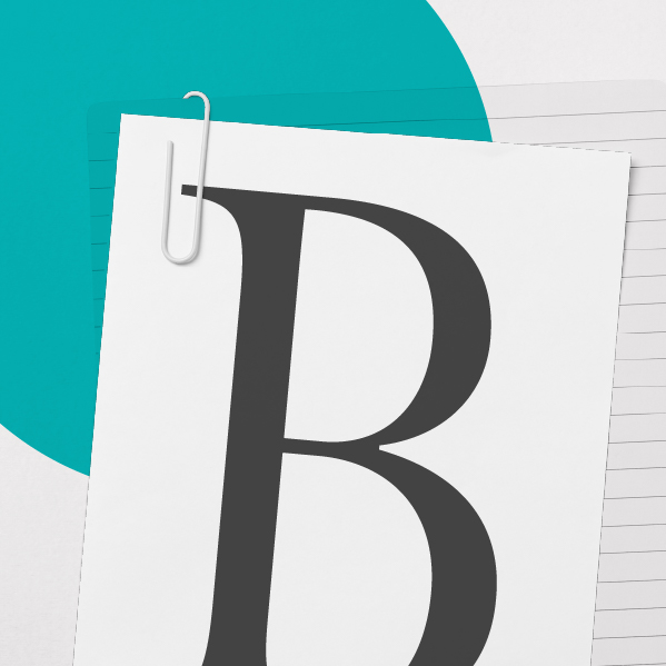 Black and White image of papers with typogrpahy on it to depict Brand Identity & Visual Language